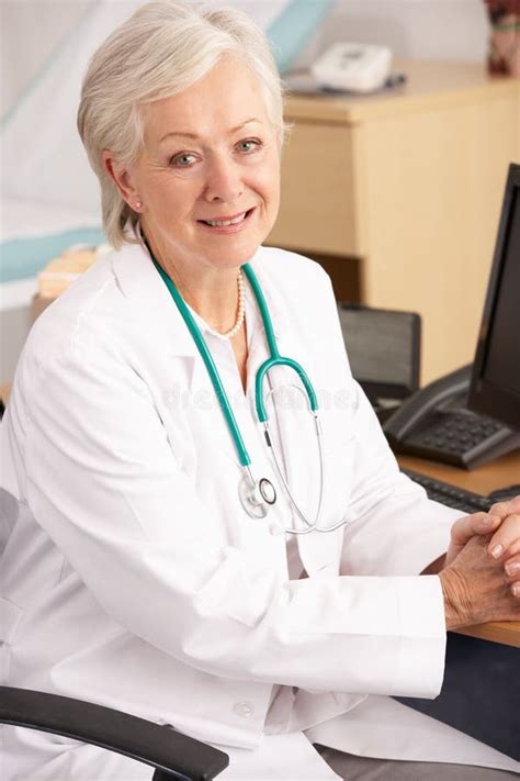 American Female Doctor Sitting At Desk Stock Image Image Of Desk