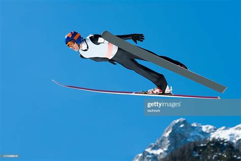 Ski Jumper In Action Against The Blue Sky High Res Stock Photo Getty