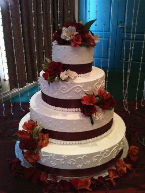 Wedding Cakes With Snowflakes And Burgandy Ribbon