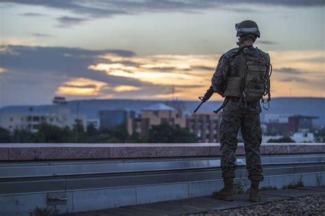 A Us Marine Security Guard Msg Provides Security On The Roof Of The