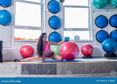 At Gym Smiling Brunette Doing Stretching Exercise Stock Image Image Of Energy Female