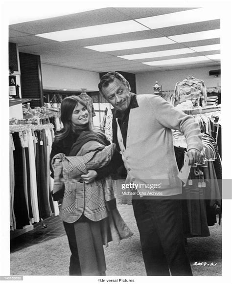 William Holden Takes Kay Lenz On A Shopping Spree In A Scene From The