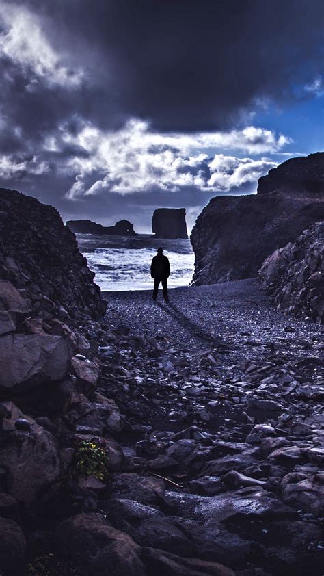 Download Wallpaper 1350x2400 Loneliness Rocks Man Shore Sea Stones