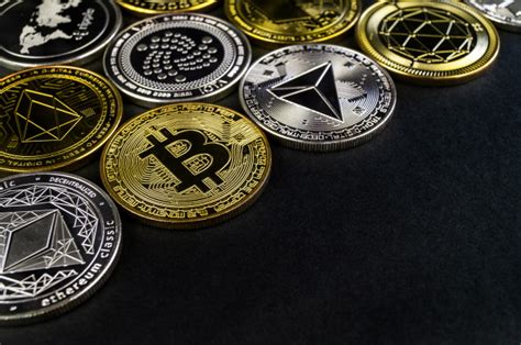 In addition, on each of them, you can create a cryptocurrency. A lot of cryptocurrency coins lie on a dark surface Photo ...