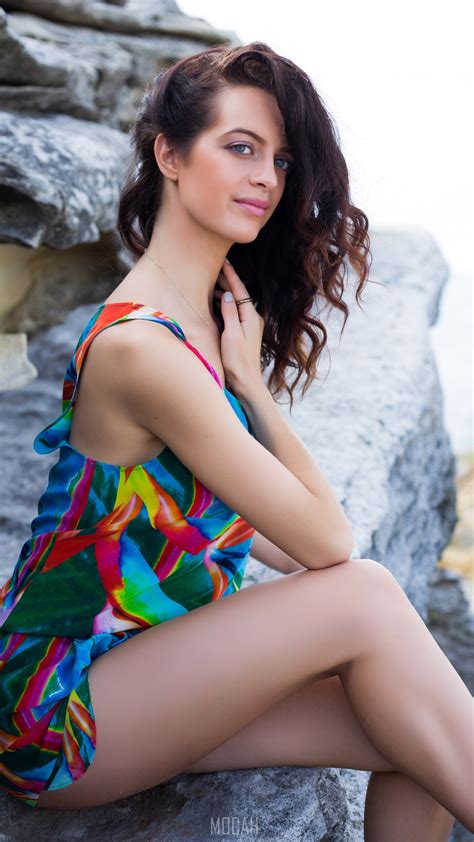 272178 Woman Sitting On Rocks Posing In Colorful Swimsuit At Bondi