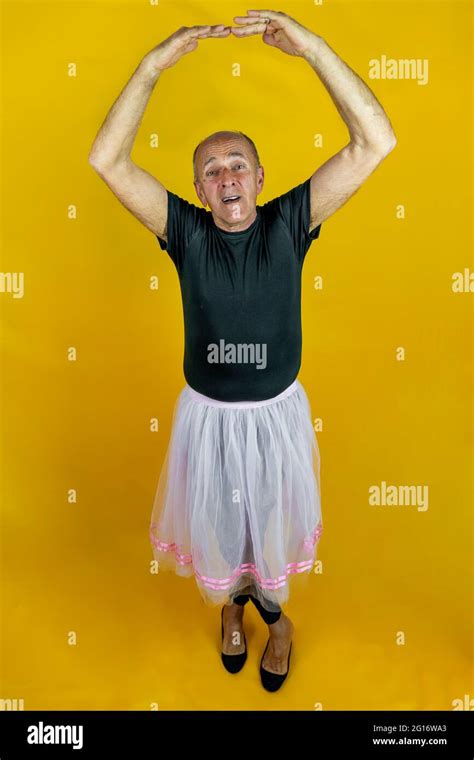 Funny Portrait Of Male Ballet Dancer A Mature Ballet Dancer Dressed In Tutu Dancing Clumsily On