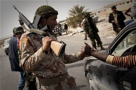 Libya Rebels Surge Forward Close In On Gadhafis Air Raid Battered
