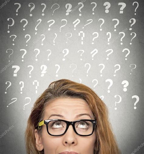Woman With Puzzled Face Expression And Question Marks Above Head
