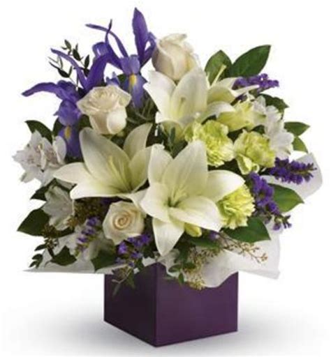 We offer flower delivery to brisbane & most regional queensland centres. Lily Floral Arrangement: Lilies, Roses & Blue Iris ...