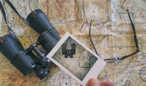 Man Holding Polaroid Photo Over A Map Stock Image Image Of Glasses