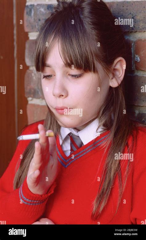 Schoolgirl In Uniform Smoking A Cigarette Cigaret Stock Photo Alamy