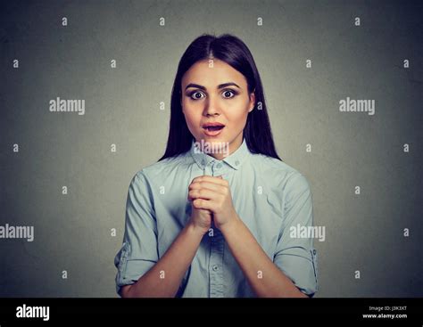 Surprised Woman Over Gray Wall Background Stock Photo Alamy