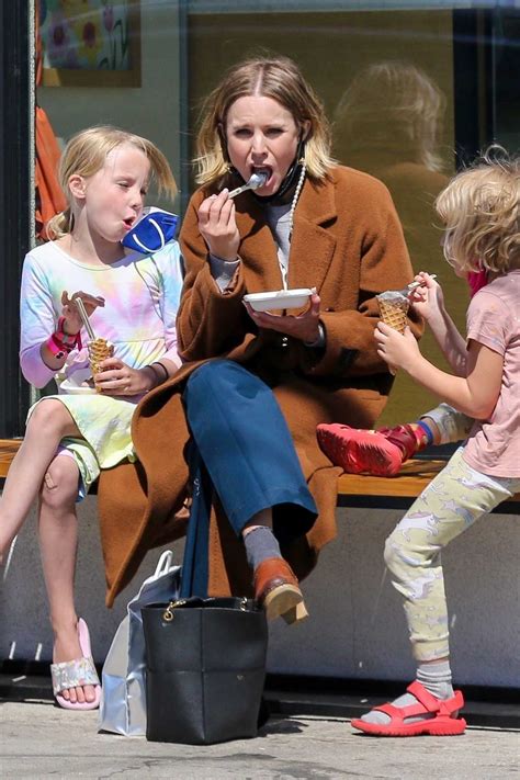 kristen bell in a tan coat takes her daughters out for ice cream at jeni s splendid ice creams