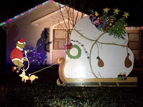 These pictures of the grinch stealing lights showcases a genius idea to avoid the headaches of stringing lights across your entire house. The grinch wood cutout scene , yard art. | Grinch christmas decorations, Grinch christmas ...
