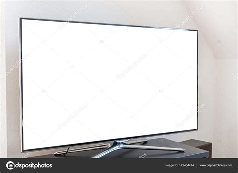 Blank White Tv Screen On A Wooden Stand In The Living Room Stock Photo