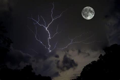 Rare Photo Of A Lightning Bolt Alongside The Moon Full Thunder Moon