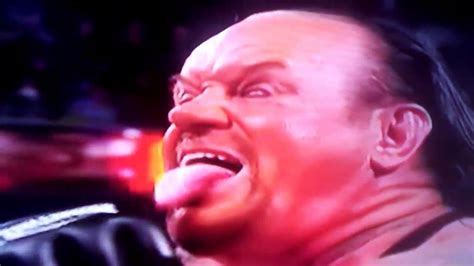 The Undertaker Sticks Out Tounge And Pulls Thumb Across Throat Towards