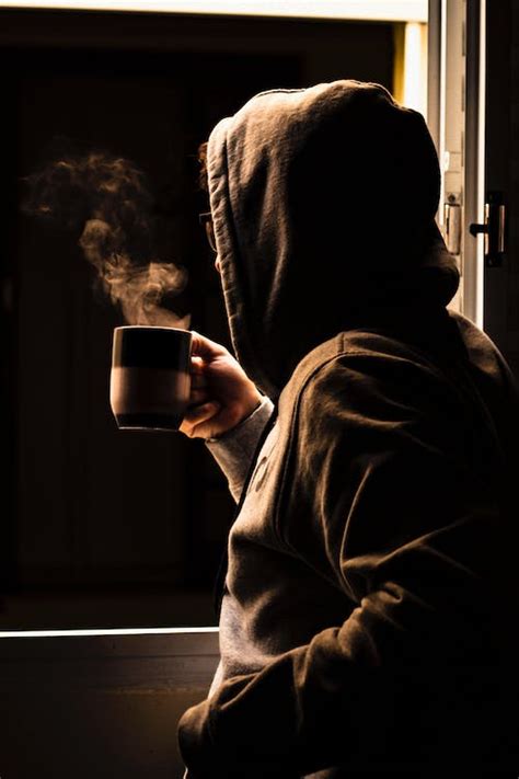 Person Drinking Coffee Next To Window · Free Stock Photo