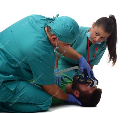 Premium Photo Doctors Giving Cardiac Massage And Resuscitation To A Male Patient In The