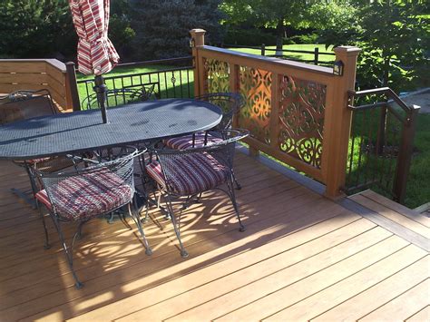 Custom Deck With Decorative Copper Art Railing Panels Rustic Deck