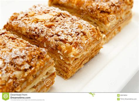 Using a wide metal spatula, transfer turnovers to a large baking sheet. French Napoleon Cake Of Puff Pastry With Sour Cream On A ...