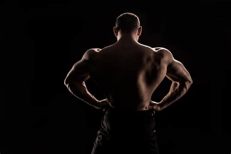 Back View Of Young Shirtless Athlete Flexing Free Stock Photo And Image