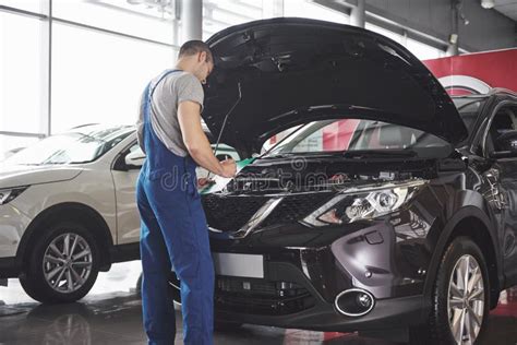 Portrait Of A Mechanic At Work In His Garage Car Service Repair