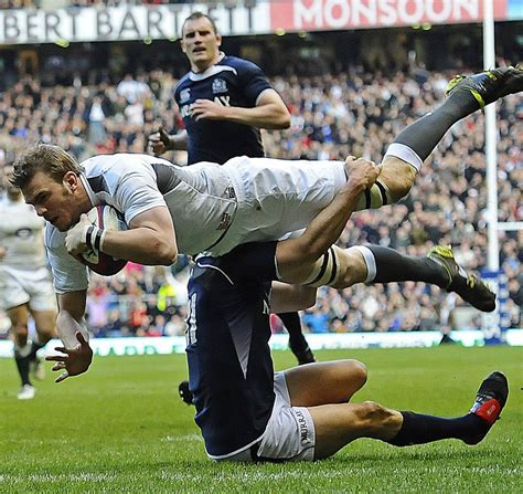 England Flanker Tom Croft Flattens The Defender In The Process Of
