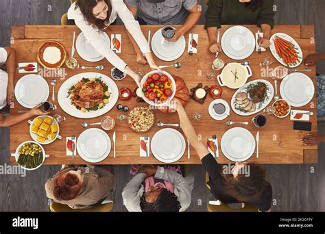 Memories Are Made When Gathered Around The Table Shot Of A Group Of People Sitting Together At