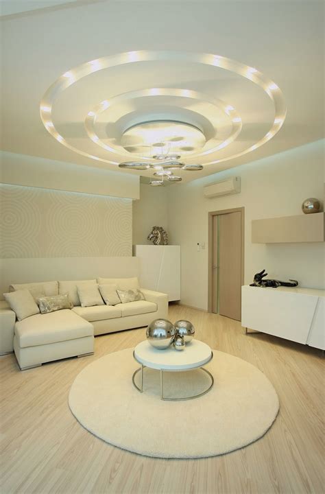Keep the centre part in pop and surround it with wooden panels. POP false ceiling designs for living room 2015