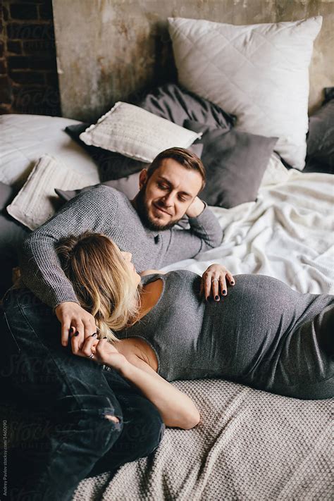 Happy Pregnant Couple Posing On Bed By Andrey Pavlov Couple Home
