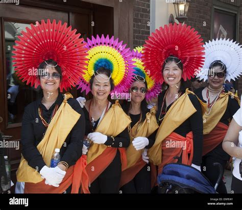 Women In Colorful Costumes Ready To Perform In The Filipino Parade On