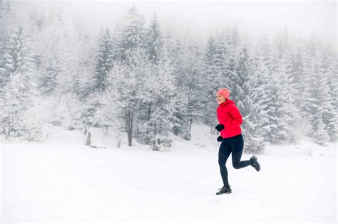 Woman Running On Snow In Winter Mountains Outdoor Troop