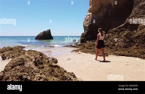 Praia Dos Tres Irmaos Beach Algarve Portugal Girl Walks Over The Sandy Stock Video Footage