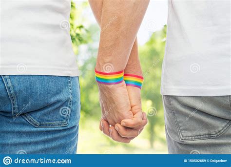 Male Couple With Gay Pride Rainbow Wristbands Stock Image Image Of