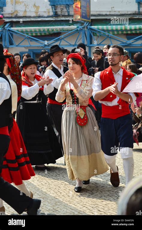 Dancers In Traditional Portuguese Dress Take Part In Folk Dancing At