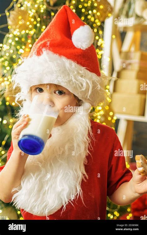Santa Claus Eating Cookies And Drinking Milk On Christmas Eve Happy