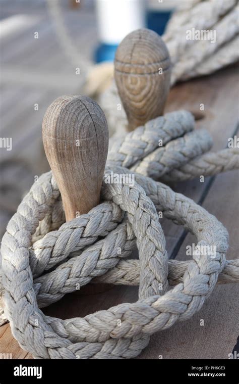 Belaying Pins With Braided Ropes On The Main Deck Of A Clipper Ship