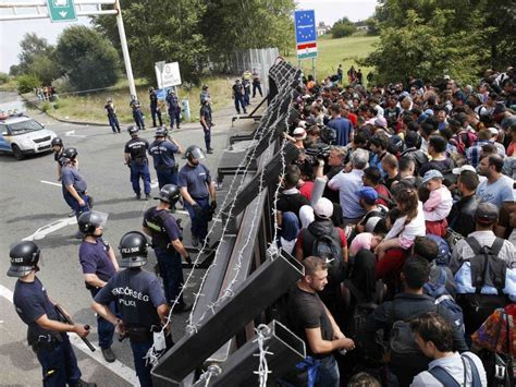 Refugee Crisis Thousands Left Stranded With Way Into Hungary Blocked By Razor Wire The