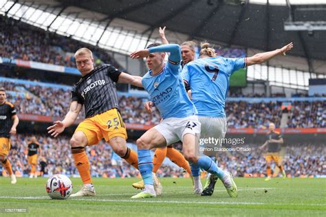 Phil Foden Of Manchester City And Rasmus Kristensen Of Leeds United
