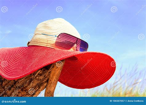 Red Elegant Women Summer Hat With Sunglasses On Blue Sky Background Stock Image Image Of