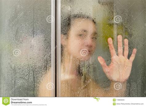 Beautiful Woman In The Shower Behind A Glass Door With Drops Woman