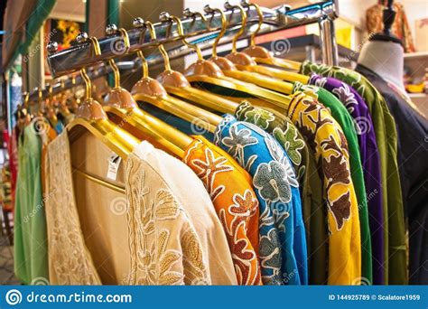 Choice Of Fashion Clothes Of Different Colors On Hangers Stock Image