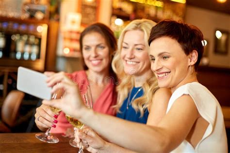 women taking selfie by smartphone at wine bar stock image image of person female 129724845