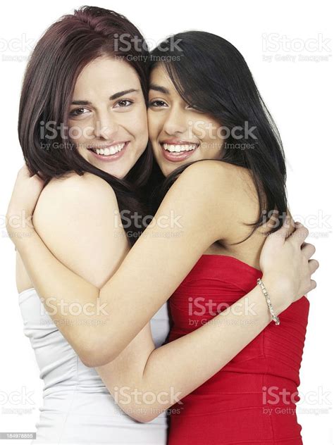 Two Beautiful Girls Hugging And Smiling Stock Photo Download Image
