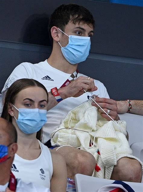 tom daley seen knitting in stands at tokyo olympics photos popsugar fitness