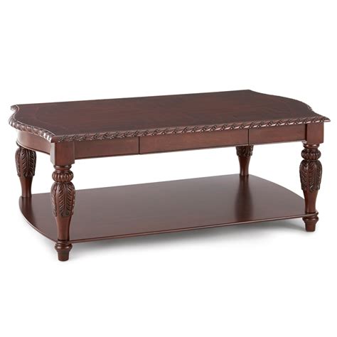 Supported by a sleek steel frame, this coffee table boasts a smooth wood tabletop and bottom shelf. Steve Silver Antoinette Rectangular Wood Coffee Table in ...