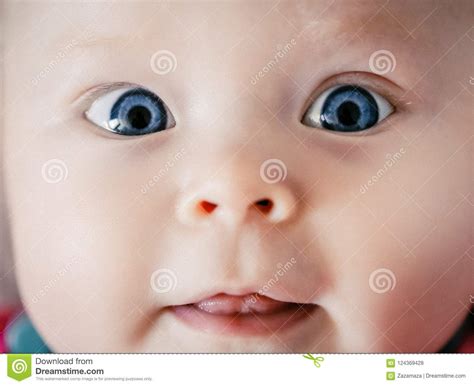 Adorable And Cute Face Baby Looking At Camera Close Up