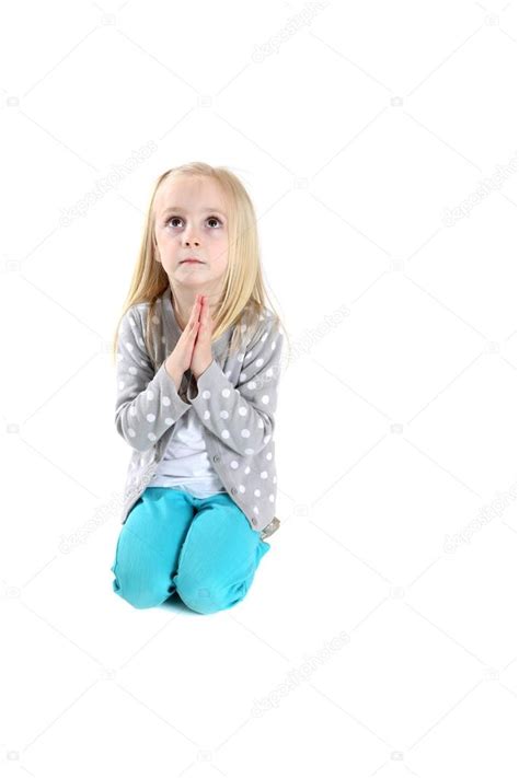 Adorable Young Girl Kneeling In Prayer Looking Up Stock Photo By