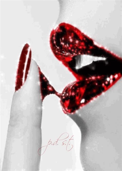 a woman s lips and hands with red glitter on them while she is holding her mouth open